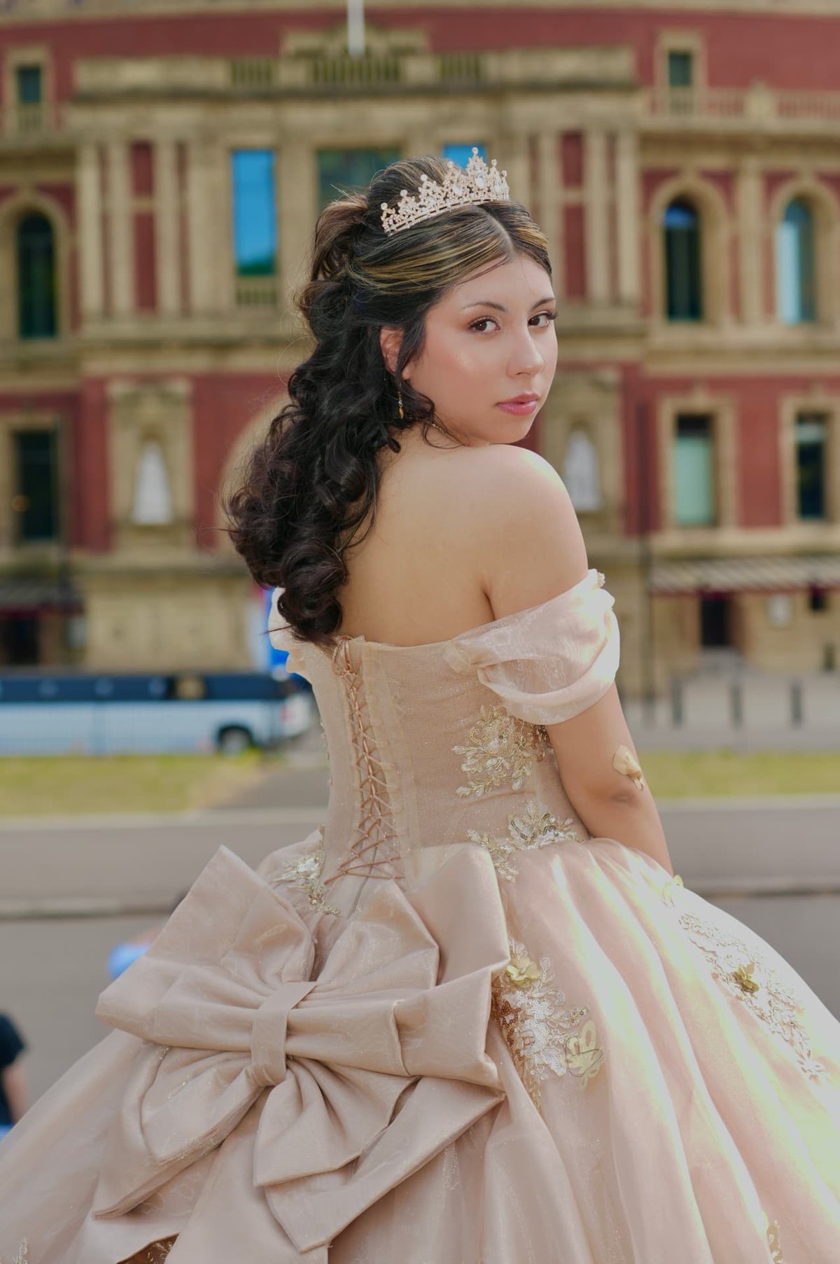 Quinceanera portrait in a blush ball gown outside the Royal Albert Hall in London